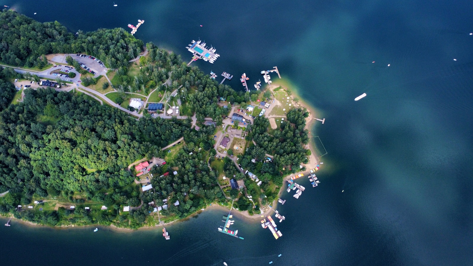 Aerial view of a lush island with docks.