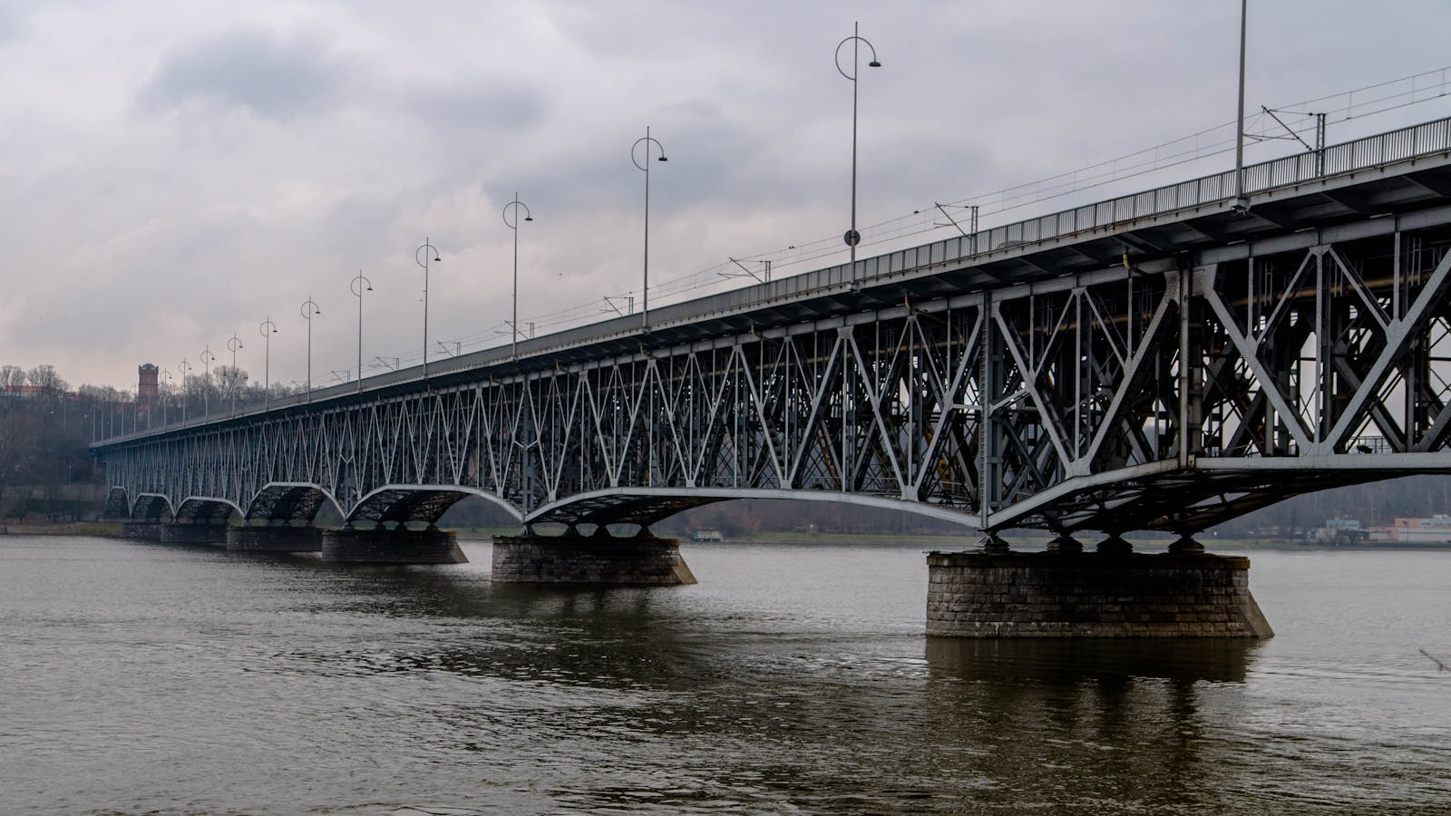 Photo by Michał Steel bridge spanning the Vistula River in Płock, Poland, showcasing modern architecture.