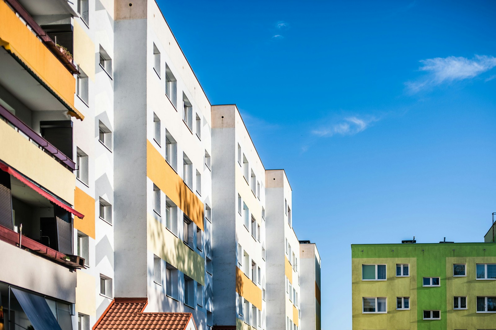 a row of multicolored buildings next to each other